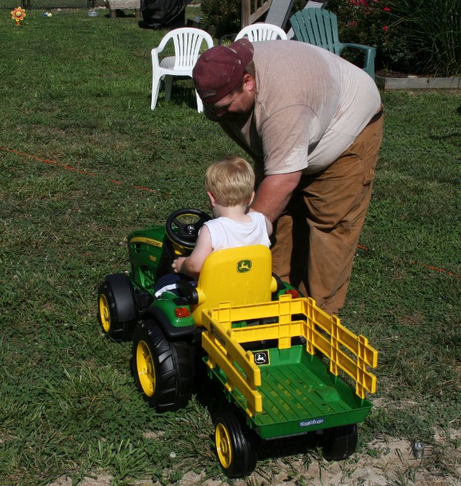 Dad demonstrates the tractor radio